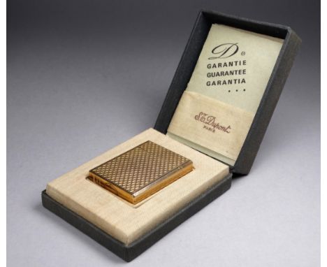 A gilt metal Dupont, Paris lighter - engine turned rectangular body with box and papers. 
