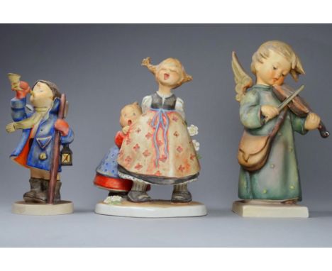 A Hummel figure - modelled as a violinist with angel's wings, height 18cm, together with two further Hummel figures. 