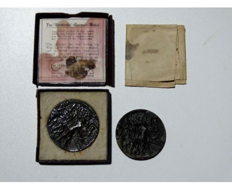 A Lusitania medal, boxed with leaflet - together with a similar example.