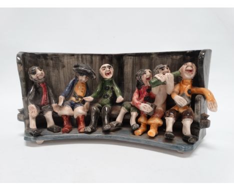 Alan Young for Runnaford Pottery - six revellers on a bench, signed to base, width 26cm