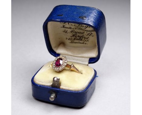 An amethyst and pearl dress ring - the oval setting on a 9ct yellow gold band, weight 2g, boxed. 