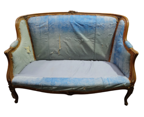 An early 20th century Louis XVI style walnut framed upholstered sofa - carved with flower buds and raised on cabriole legs, w