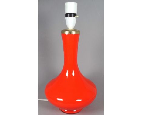 A orange glass lamp in the manner of Holmegaard - of bellied form and with slim neck,  height 31cm. 