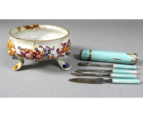 A 19th century foliate enamel salt - raised on tripod pad feet, together with a green guilloche enamel manicure set (2)