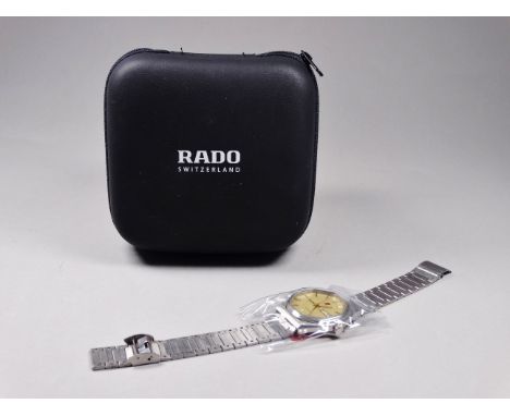A Rado Voyager gentlemans wristwatch - the gilt octagonal dial set out with batons and date/day aperture at the 3 o'clock pos