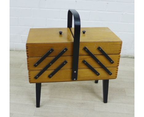 Vintage beech wood three tier concertina sewing box with ebonised strap work and legs, 32 x 42cm