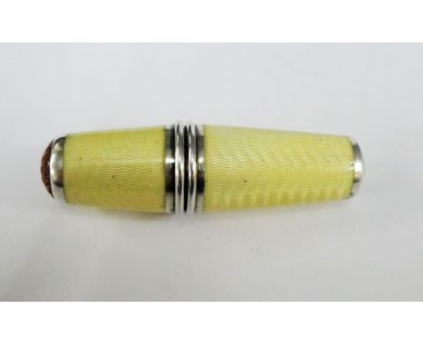 Silver and enamel bobbin case with dimpled amber panel to one end and stamped 900, 6cm long 