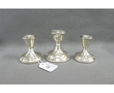 A pair of silver desk candlesticks, Birmingham 1972 and another larger candlestick, London  1908, tallest  9cm (3) 