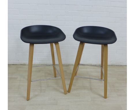Hay bar stools with black sloping seats, light wood legs and metal stretchers, 75 x 44cm, (2)