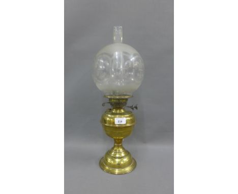 Oil lamp with an etched glass shade, complete with glass funnel, size overall 53cm 