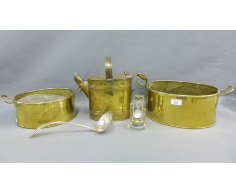 Brass wares to include two oval twin handled pans, water can, egg timer and an Epns ladle, largest 40cm (5) 