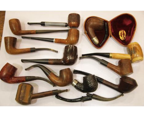 Leather cased briar two section pipe with a hallmarked silver collar, together with a collection of further pipes, including 