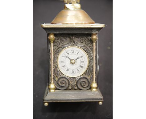 Unusual brass table lighter in the form of a mantel clock. P&amp;P Group 2 (£18+VAT for the first lot and £3+VAT for subseque