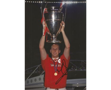 Jaap Stam signed 12x8 inch colour photograph pictured celebrating whilst holding the Champions League Trophy during his time 