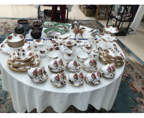 A large quantity of Royal Albert 'Old Country Roses' china: tea/coffee service, plates etc