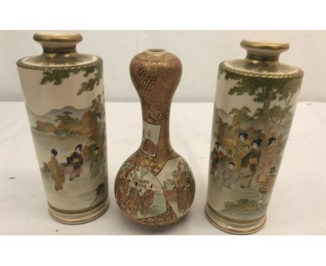 A pair of Meiji period Satsuma cylinder-shaped vases; together with a Satsuma garlic-shaped neck vase with stamp marks to bas