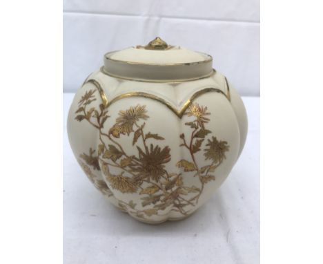 A Royal Worcester ginger jar with gilt floral designs on ivory ground: H15.5cm