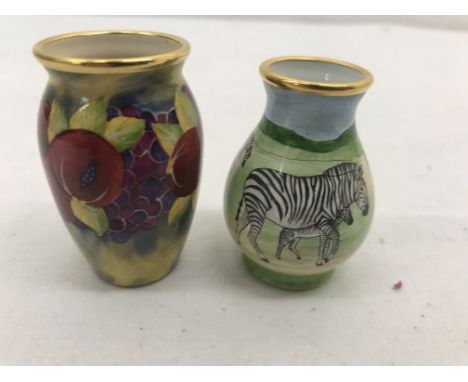 Two boxed Moorcroft enamel vases depicting zebra and flowers