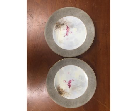 A pair of Royal Worcester flamingo plates signed by George Johnson