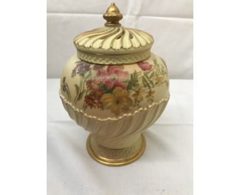 A Royal Worcester ginger jar with floral designs: H20cm