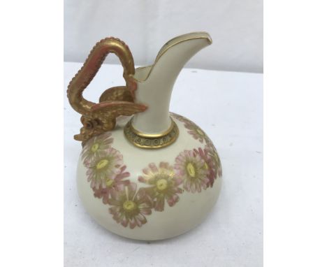 A 19th century Royal Worcester dragon ewer depicting flowers on blush ivory ground with gilt dragon handle: H15cm