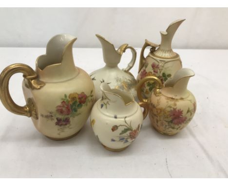 A collection of five Royal Worcester blush ivory jugs and pitchers