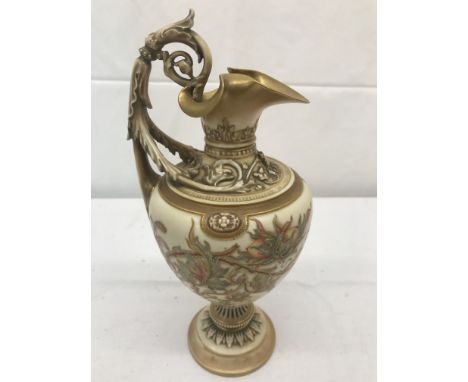 A 19th century Royal Worcester pitcher ewer with floral designs: H27cm