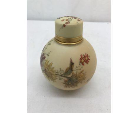 A 19th century Royal Worcester globe tea caddy with floral designs on blush ivory ground: H13cm