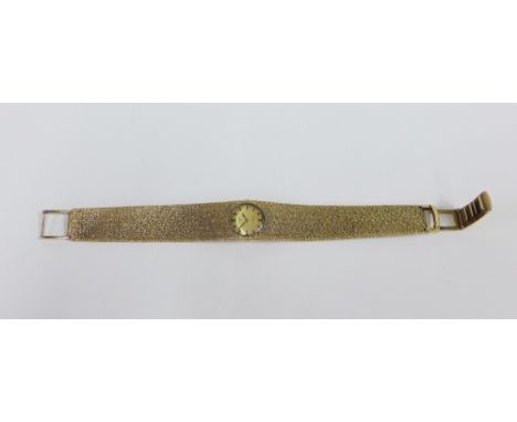 Lady's vintage 9ct gold Rotary seventeen jewels wristwatch, on a textured bracelet strap, stamped 375, overall weight 43g. 