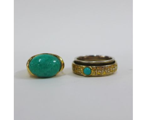 18ct gold ring with a green oval cabouchon in an engraved and scrolling gold band together with a silver and silver gilt ring