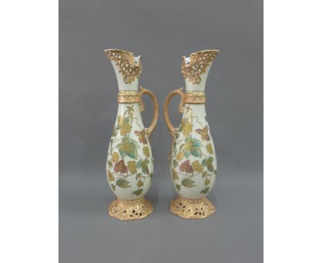 Pair of Art Nouveau continental porcelain ewers, 33cm high (20 