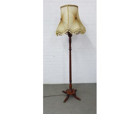Mahogany standard lamp with brass feet and a ruched style shade, 142cm to top of fitting