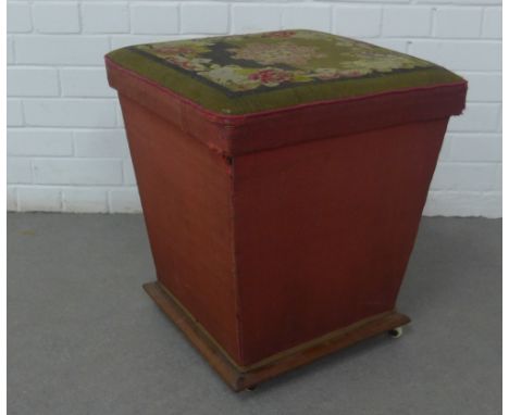 Ottoman box of tapering form, with a hinged top having tapestry upholstery, on ceramic castors, 45 x 50cm 