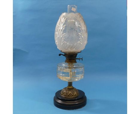 A late Victorian brass and glass Oil Lamp, with clear glass reservoir and frosted glass shade, 53cm high. 