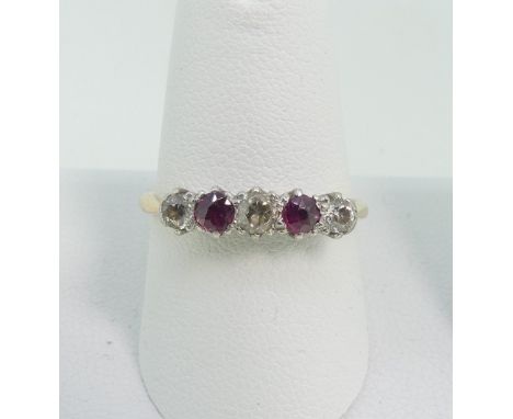 A small ruby and diamond five stone Ring,&nbsp;the three diamonds and two rubies all mounted in 18ct yellow gold and platinum