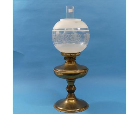 A late Victorian brass and glass Oil Lamp, with frosted and foliate glass globe, 55cm high, together with another oil lamp si