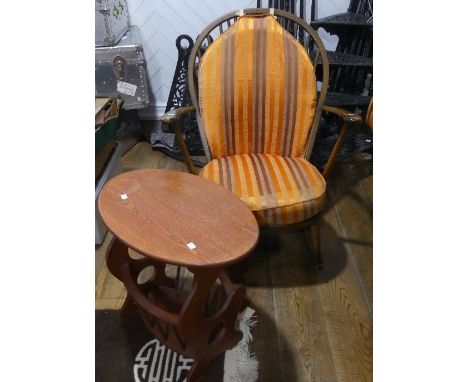An Ercol beech Rocking Chair,&nbsp;the stick and hoop back above moulded seat, with fitted cushions, 29in (74cm) wide x 28in 