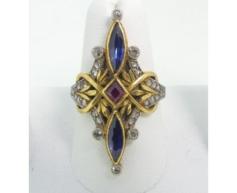 An&nbsp;elaborate early 20thC French sapphire, ruby and diamond Dress Ring,&nbsp;the central ruby with navette shaped sapphir
