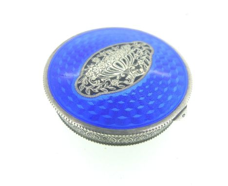 A Continental silver and enamel circular Hinged Box, the lid with blue guilloche enamel and central foliate motif, the unders