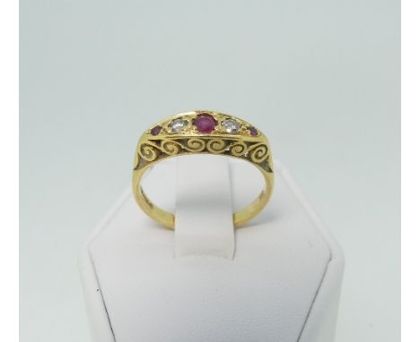 A small ruby and diamond five stone Ring,&nbsp;the boat shaped centre set with three graduated rubies and two diamonds, in a 