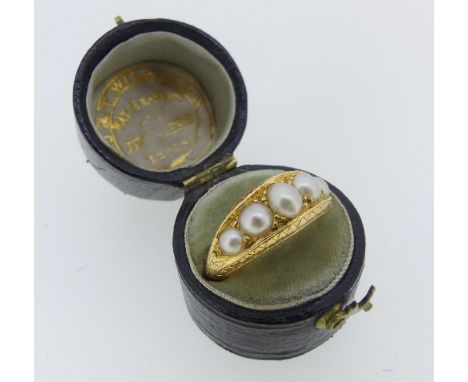An antique graduated five pearl Ring,&nbsp;in an engraved boat shaped closed back mount, all unmarked, tested as 18ct yellow 