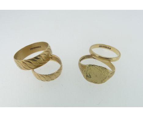 Four 9ct yellow gold Rings; A wide textured band, Size W, a plain band, Size O, a smaller textured band, Size L and a small s