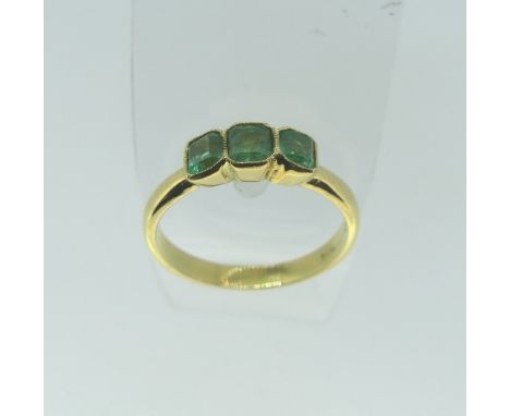 A three stone emerald Ring, mounted in 18ct yellow gold, Size Q½, approx total weight 3.7g. 