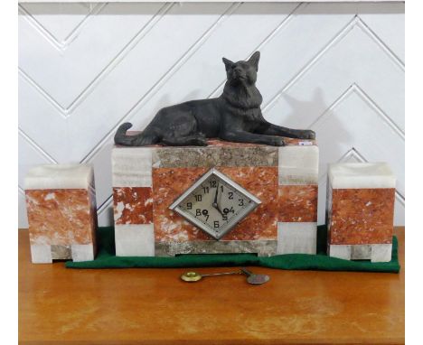 A French Art Deco three-colour marble Clock garniture, the rectangular clock with lozenge shaped dial surmounted by a spelter
