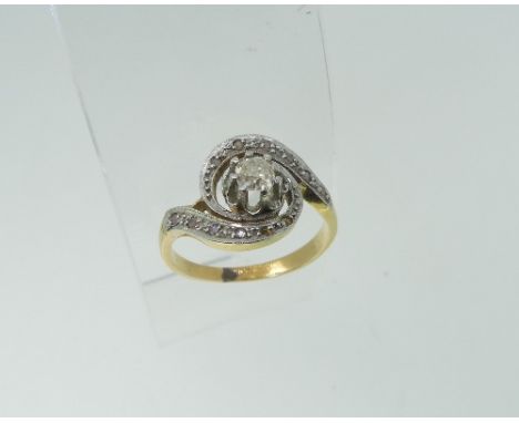 A diamond Dress Ring,&nbsp;the swirled front diamond set with a central larger diamond c.¼ct, all mounted in unmarked white a