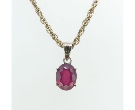 A single stone ruby Pendant,&nbsp;the oval facetted (synthetic) stone mounted in white metal, on a 9ct yellow gold ropetwist 