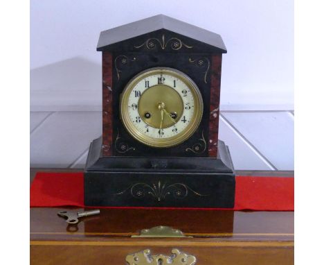 A Victorian black slate and brown marble Mantel Clock, of architectural form with circular dial, 26cm high. 