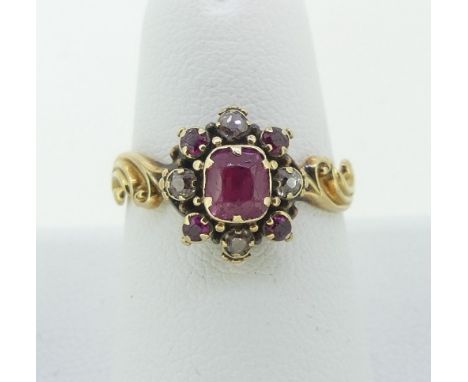A small antique ruby and diamond cluster Ring,&nbsp;the central ruby with four diamonds and four small rubies around, the rev