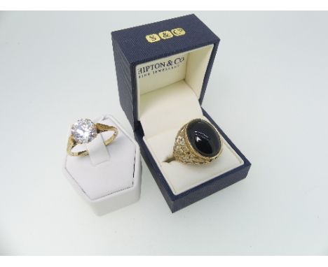 A Gentleman's large Dress Ring, with a cabochon oval onyx, wide pierced shoulders and plain shank, marked 9ct, Size 32, toget