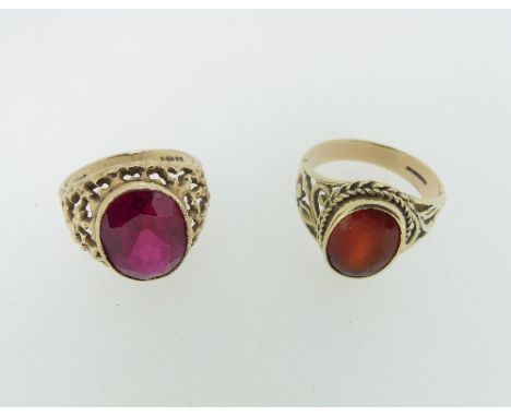 Two Gentleman's Dress Rings, one set with a large facetted Rhodochrosite, with tapering pierced shoulders, all in 9ct yellow 